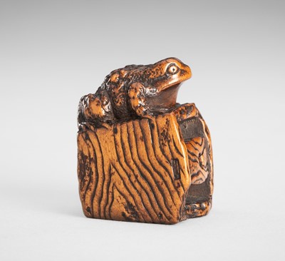 Lot 1650 - MASANAO: A WOOD NETSUKE OF A FROG ON A BUCKET