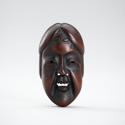 A WOOD MASK NETSUKE OF OKAME