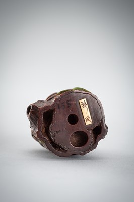 Lot 523 - RYUMIN: A WOOD NETSUKE OF HANASAKA-JIJI WITH A BASKET OF ASHES
