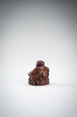 Lot 523 - RYUMIN: A WOOD NETSUKE OF HANASAKA-JIJI WITH A BASKET OF ASHES