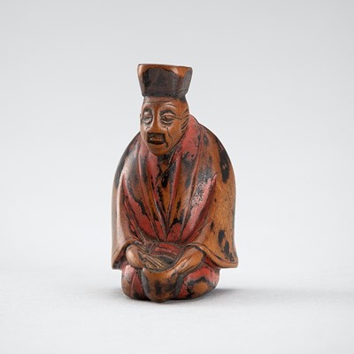 Lot 667 - A WOOD AND NEGORO LACQUER NETSUKE OF A TEA MASTER