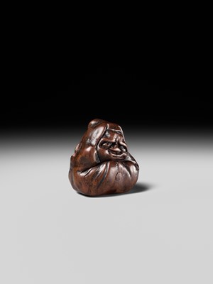 Lot 218 - MIWA: AN INLAID WOOD NETSUKE OF AN OLD CHINESE COIN AND DARUMA (ZENI AND ZEN)