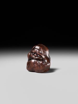 Lot 218 - MIWA: AN INLAID WOOD NETSUKE OF AN OLD CHINESE COIN AND DARUMA (ZENI AND ZEN)