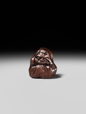 Lot 218 - MIWA: AN INLAID WOOD NETSUKE OF AN OLD CHINESE COIN AND DARUMA (ZENI AND ZEN)