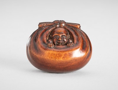 Lot 1609 - RYUGYOKU: A WOOD NETSUKE OF HOTEI IN HIS TREASURE BAG