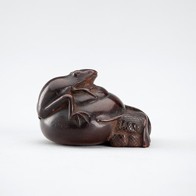 Lot 379 - A WOOD NETSUKE OF A FROG ON A SNAIL