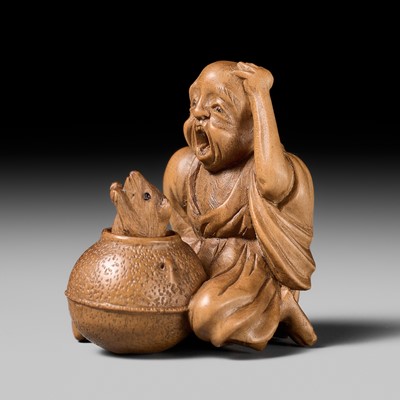 Lot 284 - AN AMUSING WOOD KARAKURI (TRICK) NETSUKE OF THE BUNBUKU-CHAGAMA