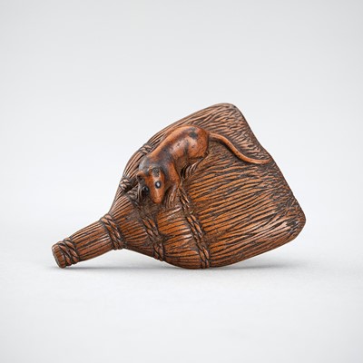 Lot 412 - A WOOD NETSUKE OF RAT ON A SHURO BRUSH