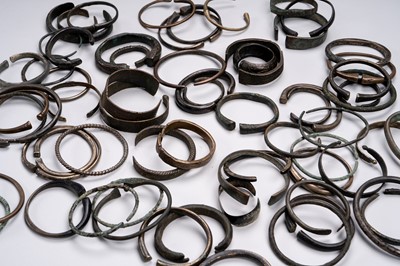 A LOT WITH SIXTY-SIX MIXED METAL TRIBAL BANGLES