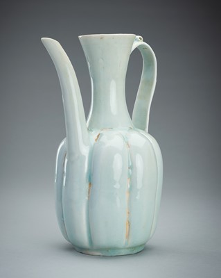 Lot 1849 - A LOBED QINGBAI GLAZED PORCELAIN EWER, SONG STYLE