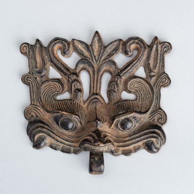 Lot 1576 - A BRONZE TAOTIE MASK FITTING WITH RING HOOK, MING DYNASTY OR LATER