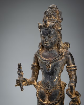 A BRONZE FIGURE OF DEWI SRI, JAVA