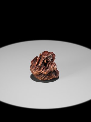 Lot 90 - MINKO: A POWERFUL WOOD NETSUKE OF A COILED DRAGON