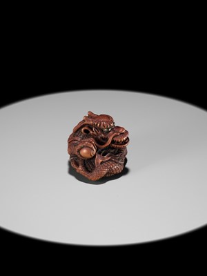 Lot 90 - MINKO: A POWERFUL WOOD NETSUKE OF A COILED DRAGON