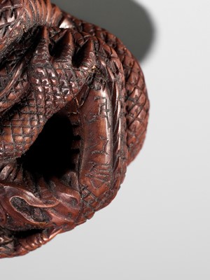 Lot 90 - MINKO: A POWERFUL WOOD NETSUKE OF A COILED DRAGON