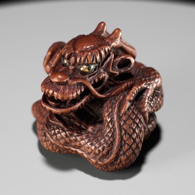 Lot 90 - MINKO: A POWERFUL WOOD NETSUKE OF A COILED DRAGON