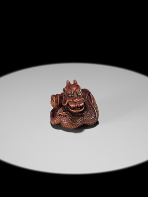 Lot 90 - MINKO: A POWERFUL WOOD NETSUKE OF A COILED DRAGON