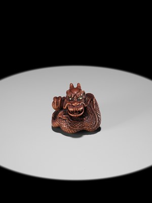 Lot 90 - MINKO: A POWERFUL WOOD NETSUKE OF A COILED DRAGON