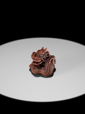 Lot 90 - MINKO: A POWERFUL WOOD NETSUKE OF A COILED DRAGON