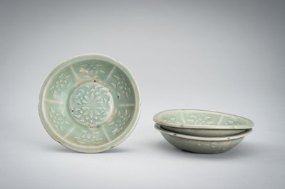 Lot 950 - THREE SMALL CELADON GLAZED AND MOLDED PORCELAIN DISHES, 12TH CENTURY