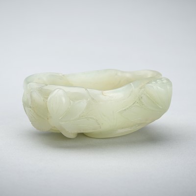 Lot 1760 - A PALE CELADON JADE ‘LOTUS’ BRUSHWASHER, QING DYNASTY