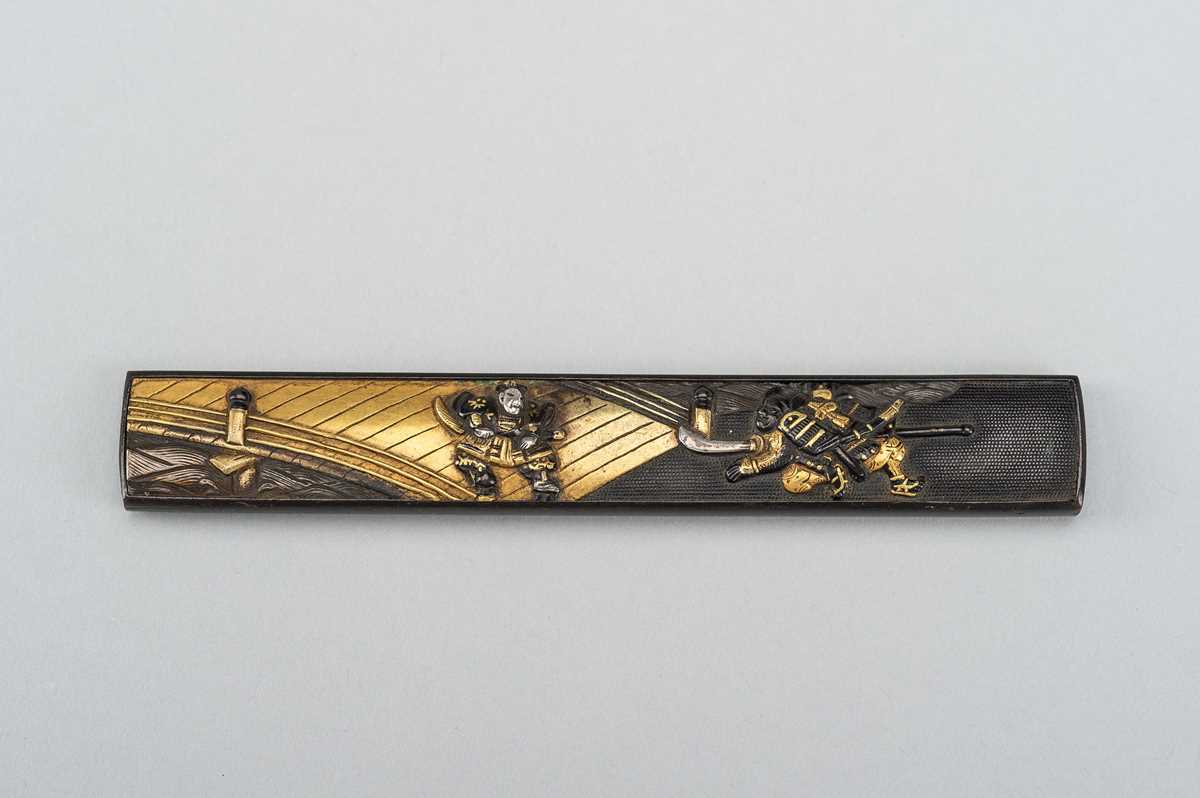 Lot 246 - A FINE SHIBUICHI KOZUKA WITH DUELING SAMURAI