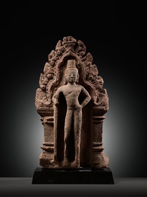 Lot 341 - A RED SANDSTONE ‘GUARDIAN DEITY’ ANTEFIX, BANTEAY SREI