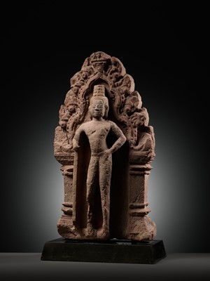 Lot 341 - A RED SANDSTONE ‘GUARDIAN DEITY’ ANTEFIX, BANTEAY SREI