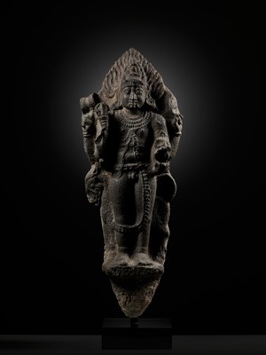 Lot 275 - A MONUMENTAL GRANITE FIGURE OF SHIVA AS BHAIRAVA, CHOLA PERIOD