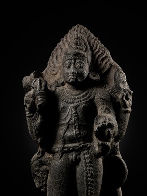 Lot 275 - A MONUMENTAL GRANITE FIGURE OF SHIVA AS BHAIRAVA, CHOLA PERIOD