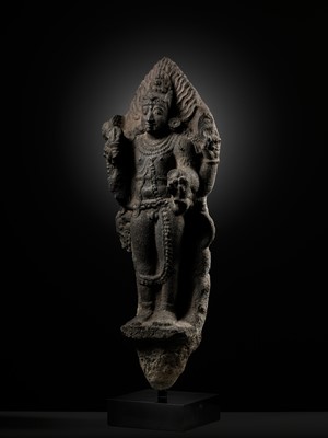 Lot 275 - A MONUMENTAL GRANITE FIGURE OF SHIVA AS BHAIRAVA, CHOLA PERIOD