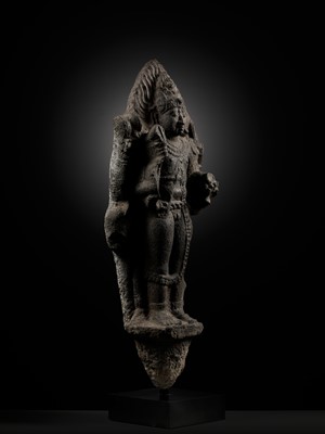 Lot 275 - A MONUMENTAL GRANITE FIGURE OF SHIVA AS BHAIRAVA, CHOLA PERIOD