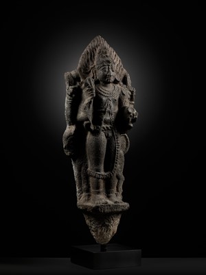 Lot 275 - A MONUMENTAL GRANITE FIGURE OF SHIVA AS BHAIRAVA, CHOLA PERIOD