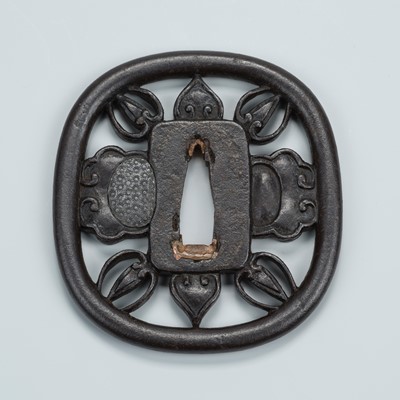 Lot 1484 - AN IRON SUKASHI TSUBA WITH ORNAMENTAL DESIGN