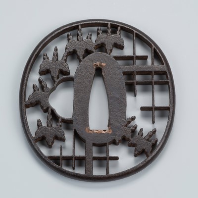 Lot 1485 - AN IRON SUKASHI TSUBA WITH PAULOWNIA LEAVES AND GEOMETRIC PATTERN