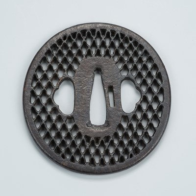 Lot 1479 - AN IRON SUKASHI TSUBA WITH DIAMOND PATTERN