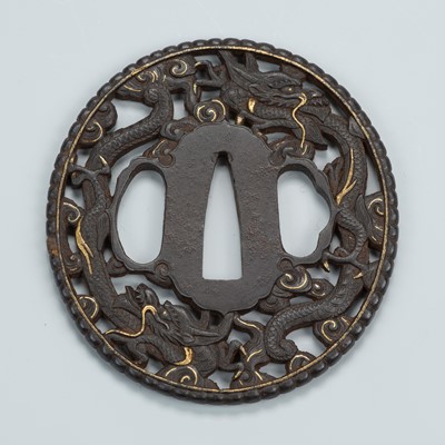 Lot 1483 - AN IRON SUKASHI TSUBA WITH DRAGONS