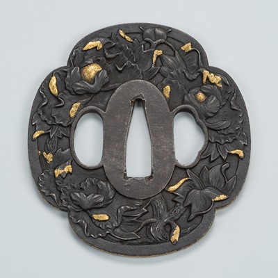 Lot 1493 - AN IRON TSUBA WITH GOLD NUNOME PEONY BLOSSOMS