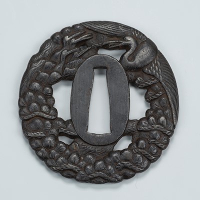 Lot 1475 - AN IRON SUKASHI TSUBA WITH CRANES AND PINE TREE