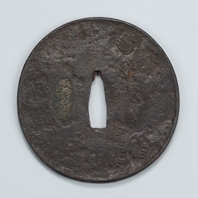 Lot 1476 - AN IRON TSUBA WITH STYLIZED CHARACTERS