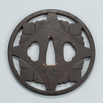 Lot 1543 - MASANAGA: AN IRON SUKASHI TSUBA WITH DECORATIVE PATTERN