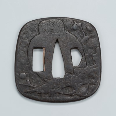 Lot 1544 - AN IRON TSUBA WITH AN OWL ON A FRUIT TREE