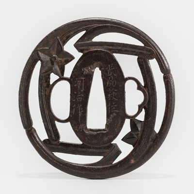 Lot 1555 - KAWAJI: A FINE IRON SUKASHI TSUBA WITH FLOWERS