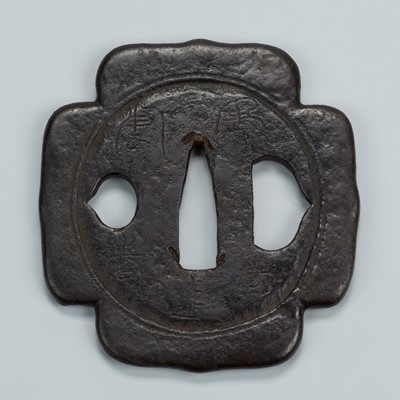 Lot 1536 - AN IRON TSUBA WITH ARCHAIC CHARACTERS