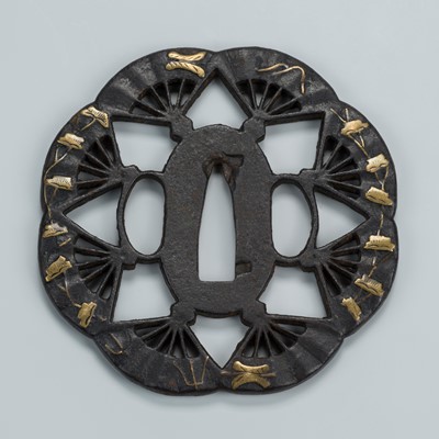 Lot 1537 - AN IRON SUKASHI TSUBA WITH RADIATING FANS