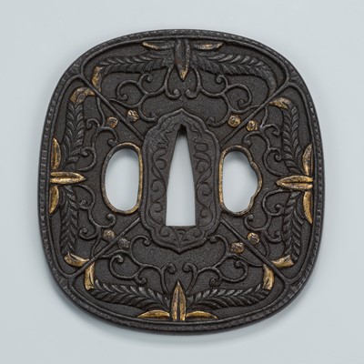 Lot 1539 - AN IRON TSUBA WITH TENDRILS AND FOLIAGE