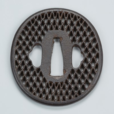 Lot 1540 - AN IRON SUKASHI TSUBA WITH DIAMOND PATTERN