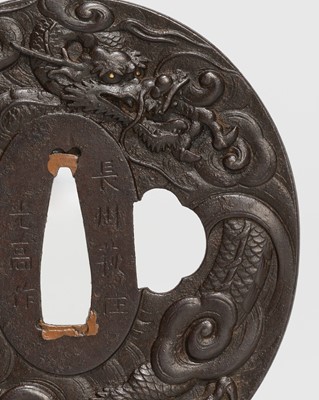 Lot 227 - ONO MITSUTAKA: AN IRON TSUBA WITH A FIERCE DRAGON