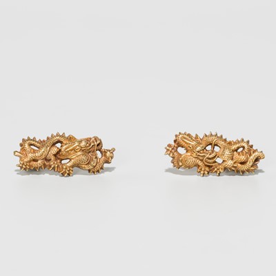 Lot 287 - A PAIR OF GOLD MENUKI DEPICTING DRAGONS