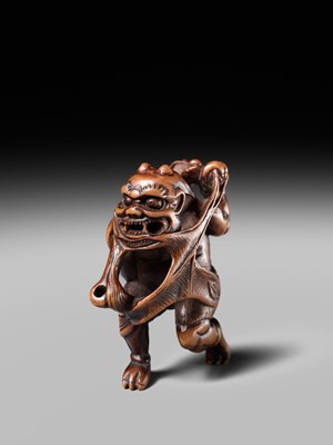 Lot 153 - A VERY RARE WOOD NETSUKE OF AN ONI CAUGHT IN A SPIDERWEB